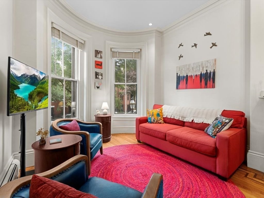103 Appleton Street, Unit 3 Boston, MA 02116 - Photo 3 of 24 a living room with furniture rug and window