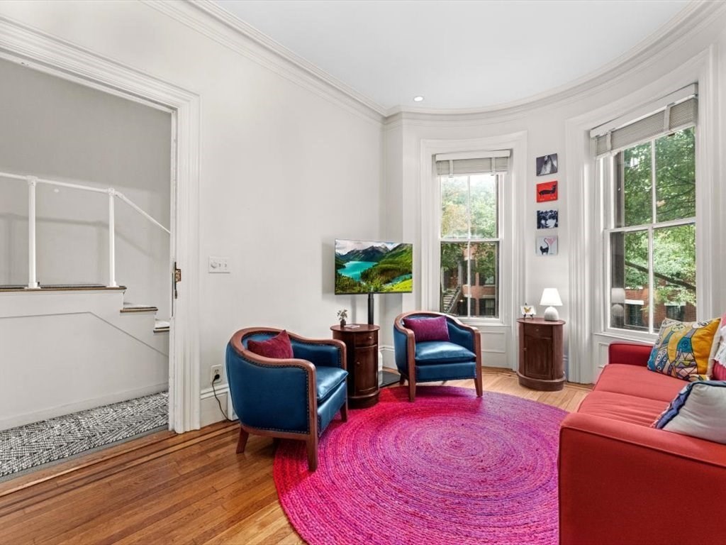 103 Appleton Street, Unit 3 Boston, MA 02116 - Photo 4 of 24 a living room with furniture rug and window