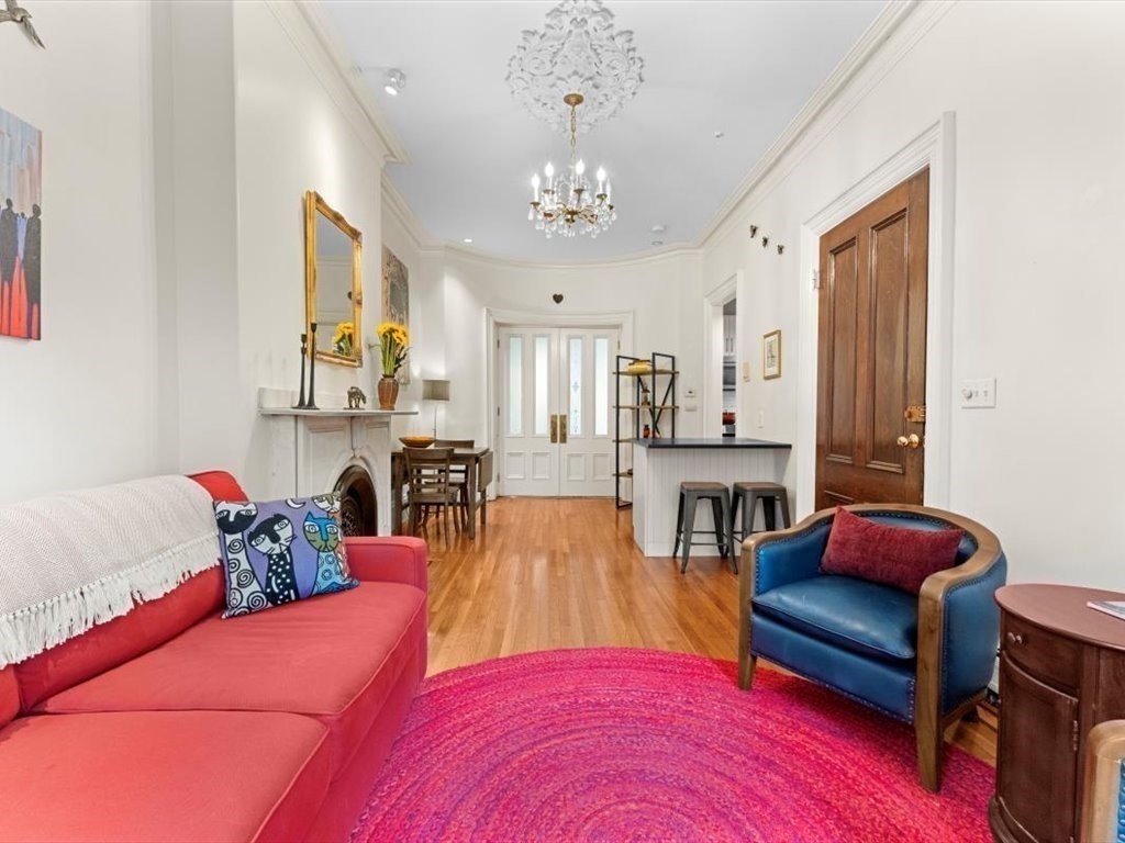 103 Appleton Street, Unit 3 Boston, MA 02116 - Photo 6 of 24 a living room with furniture and a chandelier