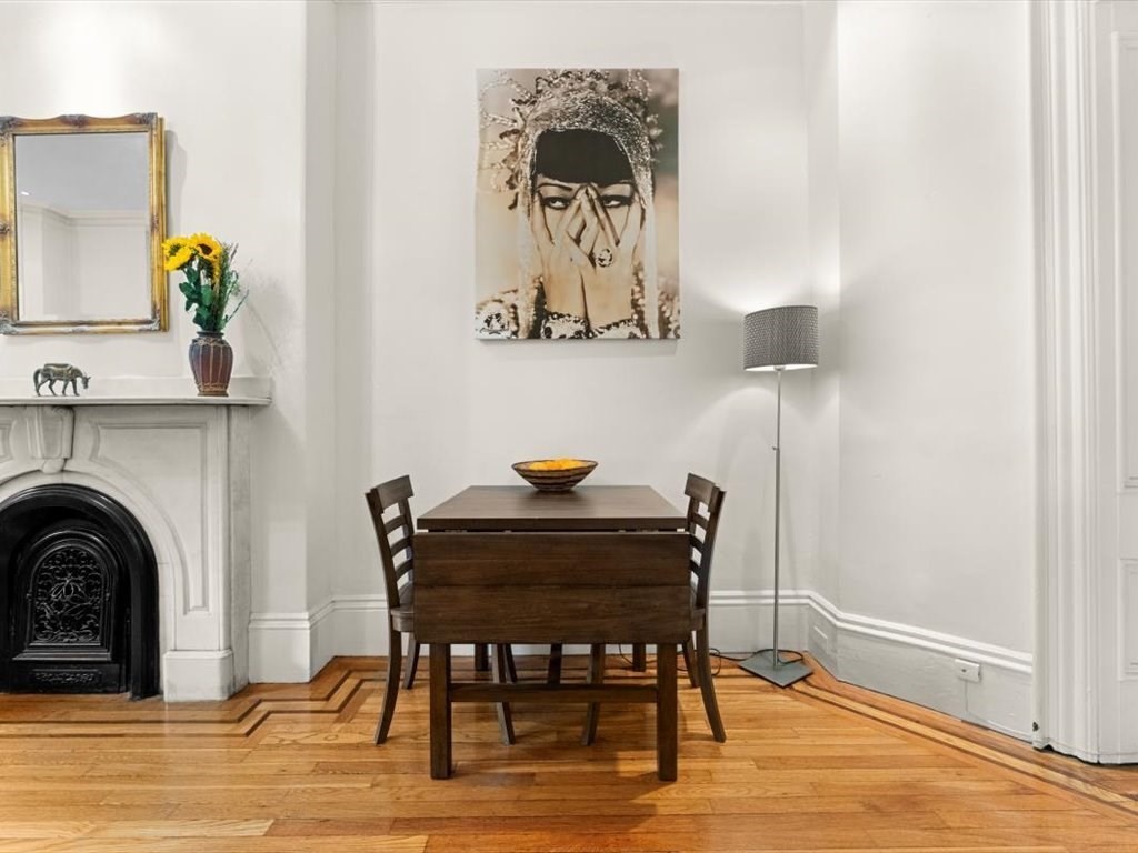 103 Appleton Street, Unit 3 Boston, MA 02116 - Photo 8 of 24 a view of a dining room with furniture and wooden floor