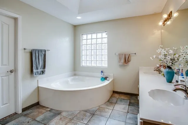 a view of a bathtub in a bathroom