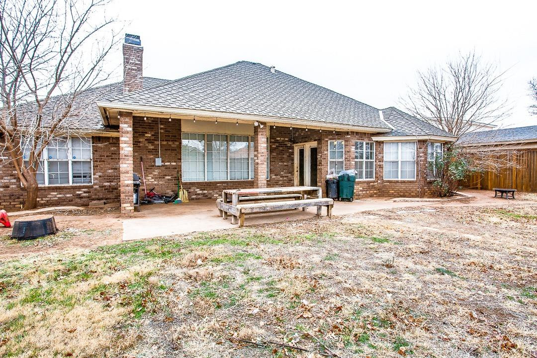 6032 79th Street Lubbock, TX 79424 - Photo 19 of 19 a backyard of a house with yard fire pit and sofas