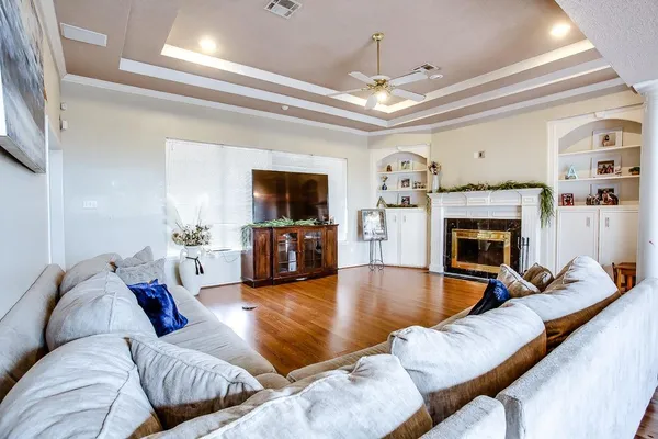 a living room with furniture and a fireplace or television