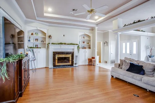 a living room with furniture and a fireplace