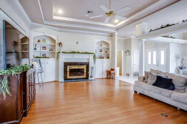 a living room with furniture and a fireplace