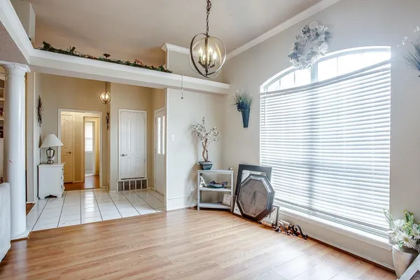a view of a livingroom with furniture window and wooden floor