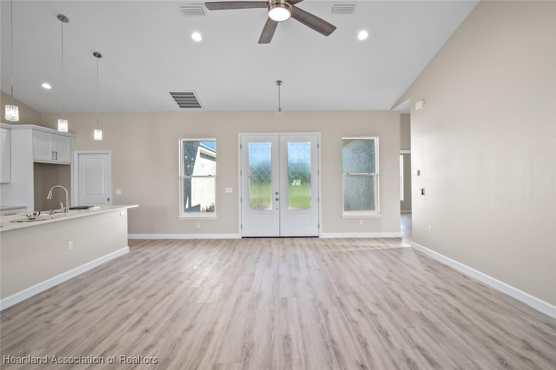 8300 Granada Road Sebring, FL 33876 - Photo 11 of 50 LIVING ROOM AND ENTRANCE DOORS