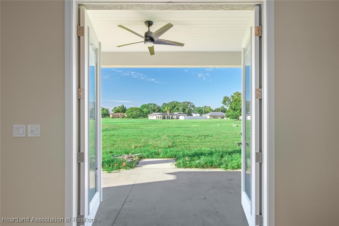 8300 Granada Road Sebring, FL 33876 - Photo 29 of 50 DOORS TO BACK PORCH