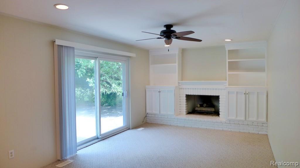 3748 Quarton Road Bloomfield Hills, MI 48302 - Photo 5 of 16 Family Room With Fireplace & Door Wall Leading To Patio