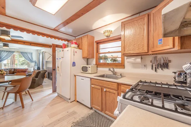a kitchen with stainless steel appliances granite countertop a stove and a refrigerator
