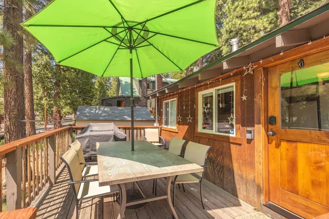 a patio with a patio table and chairs