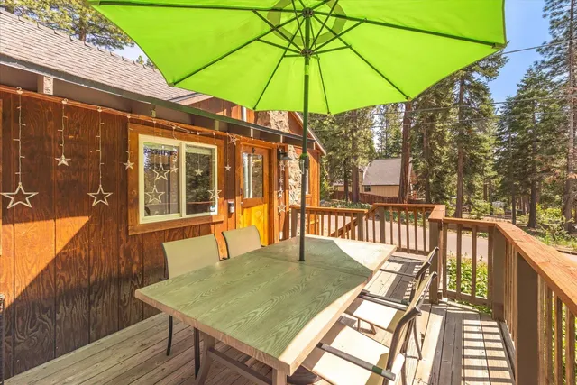 a view of balcony with wooden floor and outdoor seating