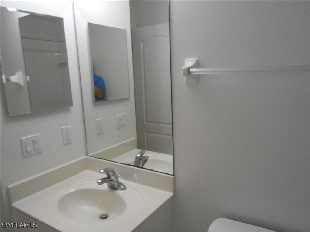 9409 Ivy Brook Run, Unit 1303 Fort Myers, FL 33913 - Photo 15 of 25 a bathroom with a sink and mirror