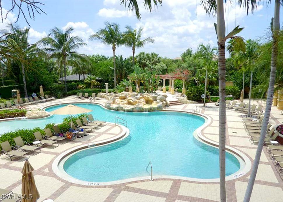 9409 Ivy Brook Run, Unit 1303 Fort Myers, FL 33913 - Photo 24 of 25 a view of a swimming pool with a patio