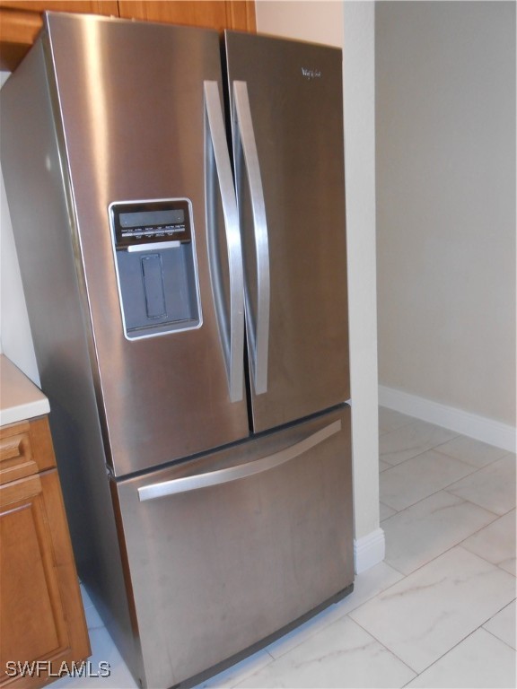 9409 Ivy Brook Run, Unit 1303 Fort Myers, FL 33913 - Photo 5 of 25 a view of a refrigerator in kitchen