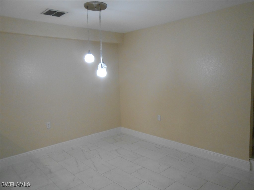 9409 Ivy Brook Run, Unit 1303 Fort Myers, FL 33913 - Photo 7 of 25 a view of an empty room with a window