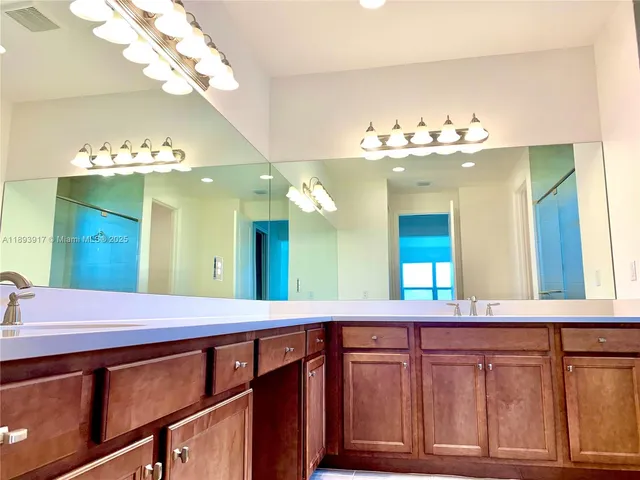 a bathroom with a shower and a window