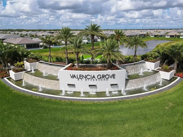 a view of a swimming pool with a yard