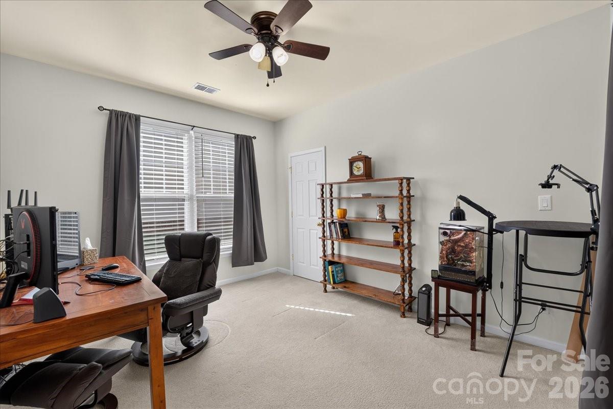 8006 Fine Robe Drive Indian Trail, NC 28079 - Photo 18 of 36 a view of a livingroom with furniture and a window