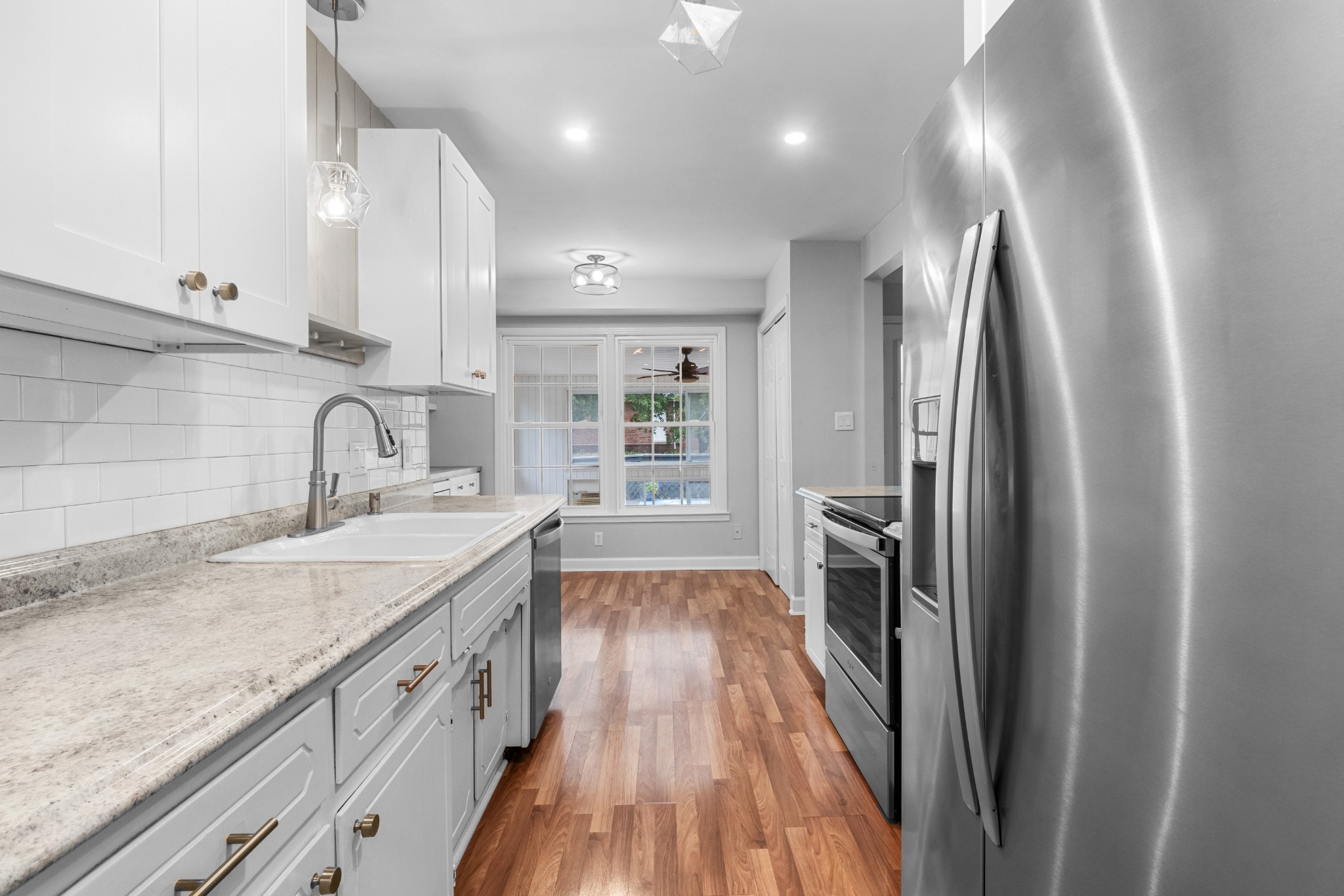 521 Sango Road Clarksville, TN 37043 - Photo 12 of 46 a kitchen with granite countertop a sink and refrigerator