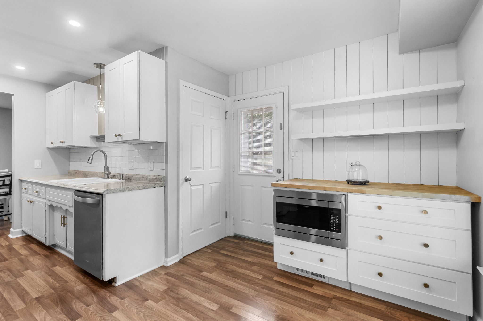 521 Sango Road Clarksville, TN 37043 - Photo 15 of 46 a kitchen with granite countertop white cabinets and white appliances