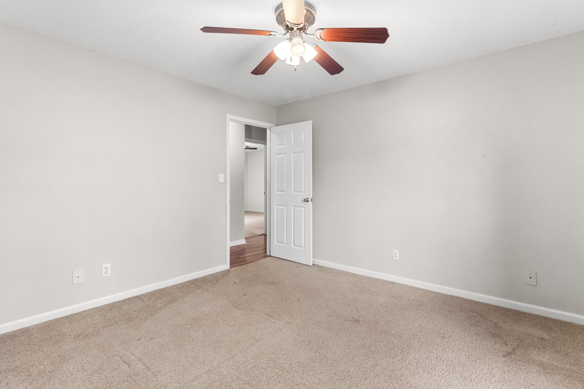 521 Sango Road Clarksville, TN 37043 - Photo 27 of 46 an empty room with closet and a chandelier fan