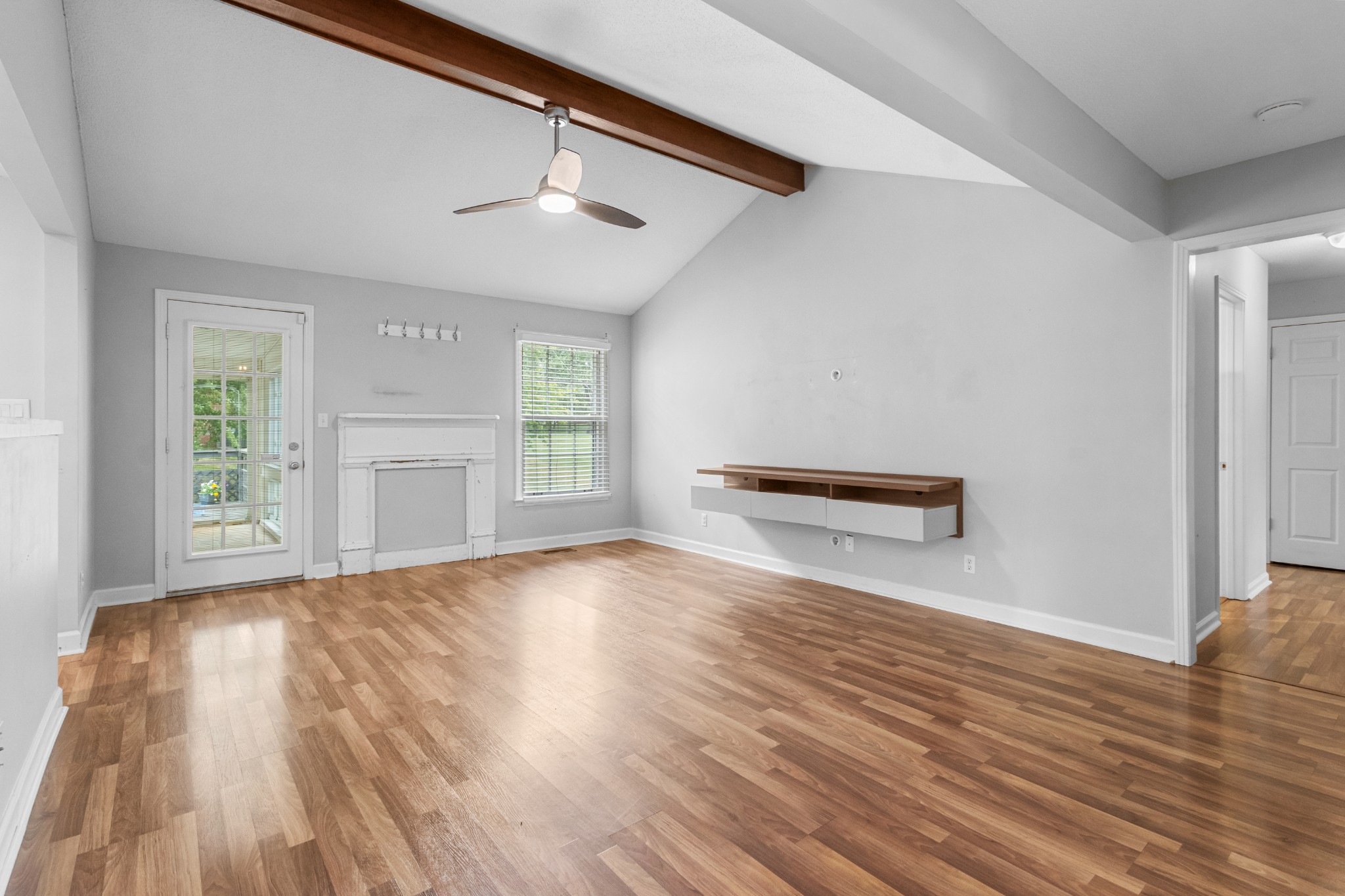 521 Sango Road Clarksville, TN 37043 - Photo 6 of 46 a view of empty room with wooden floor and fan