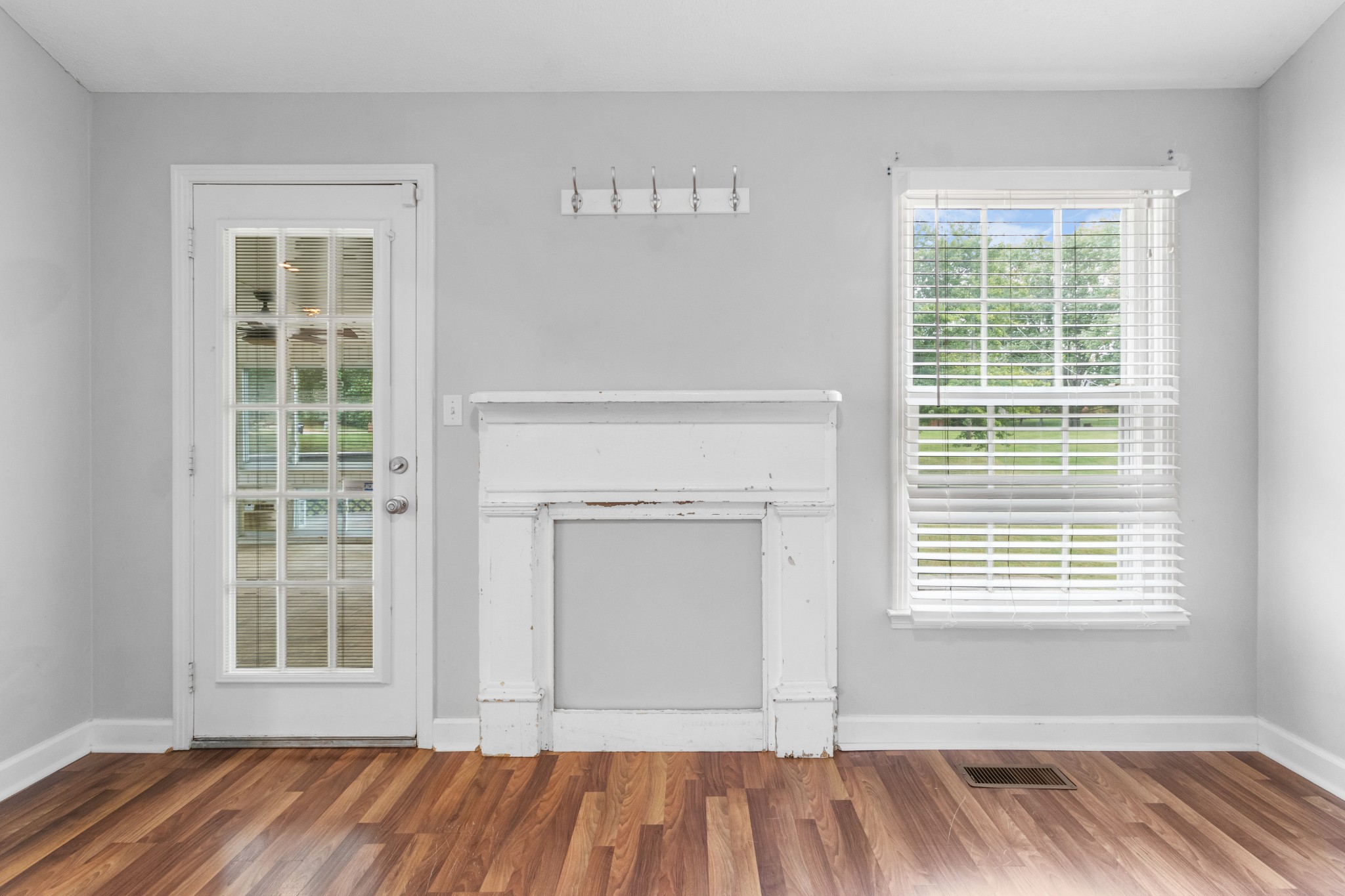 521 Sango Road Clarksville, TN 37043 - Photo 8 of 46 a view of an empty room with wooden floor and a window