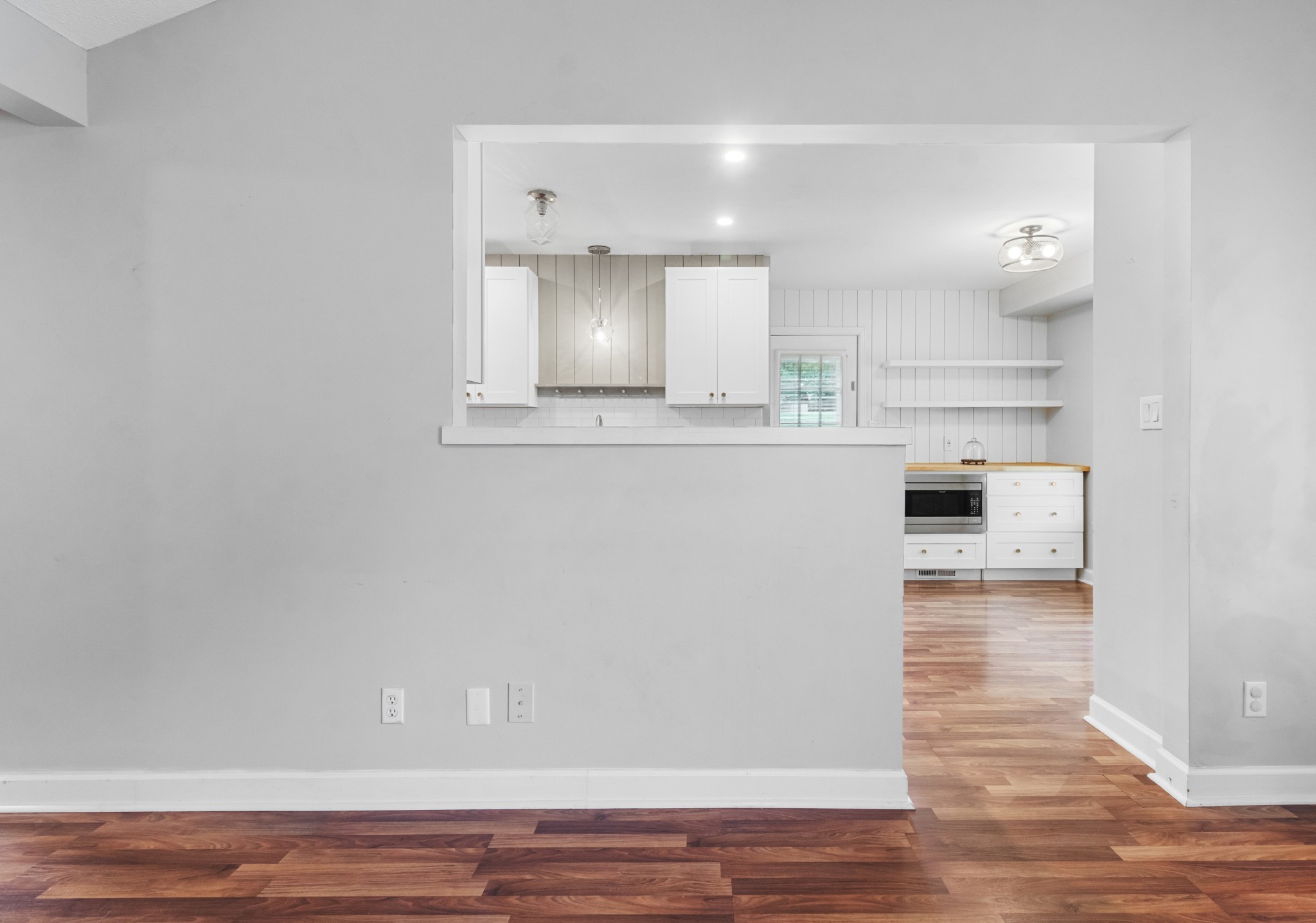 521 Sango Road Clarksville, TN 37043 - Photo 9 of 46 a view of a kitchen with wooden floor and electronic appliances