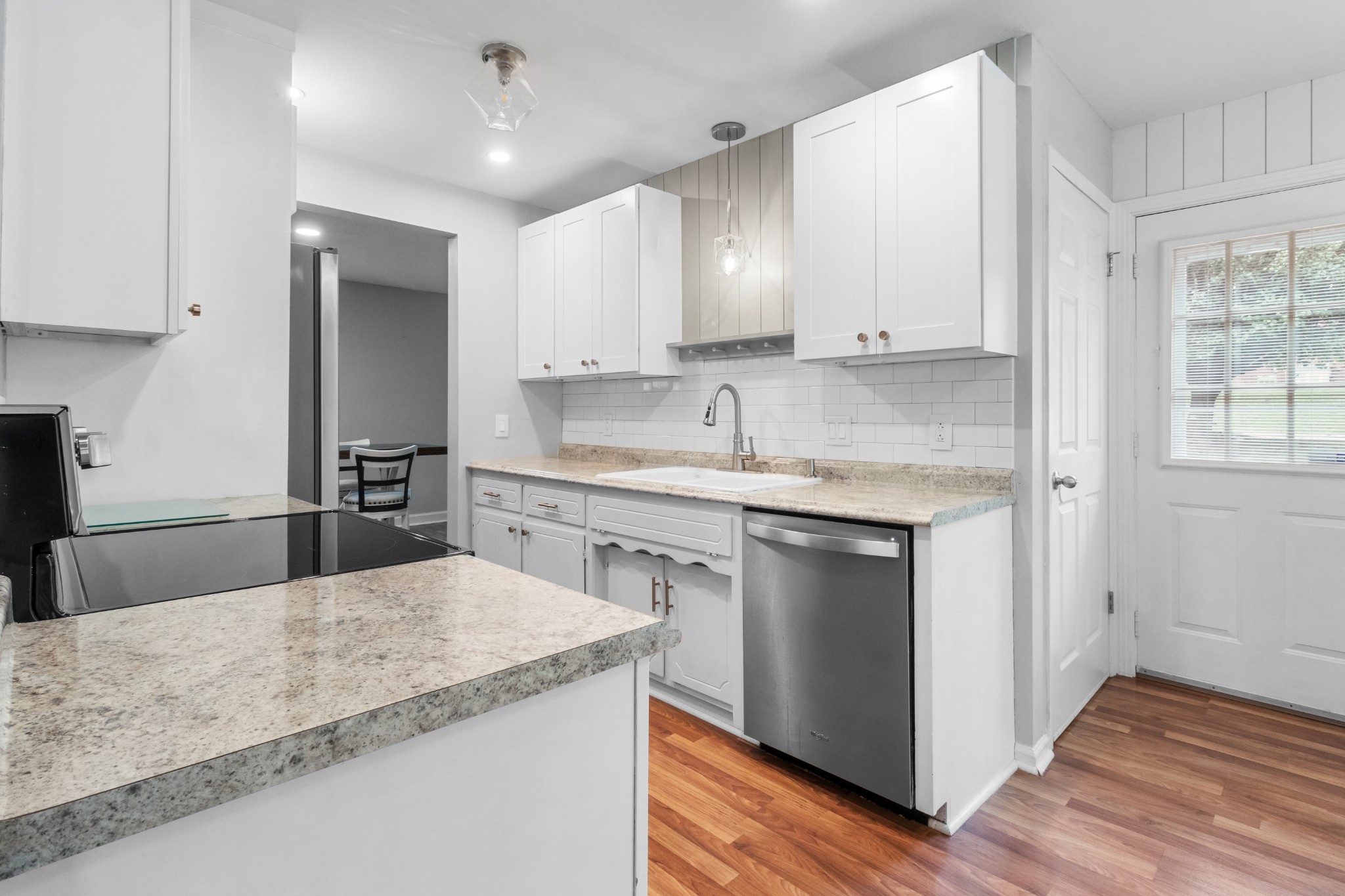 521 Sango Road Clarksville, TN 37043 - Photo 10 of 46 a kitchen with a sink window and cabinets