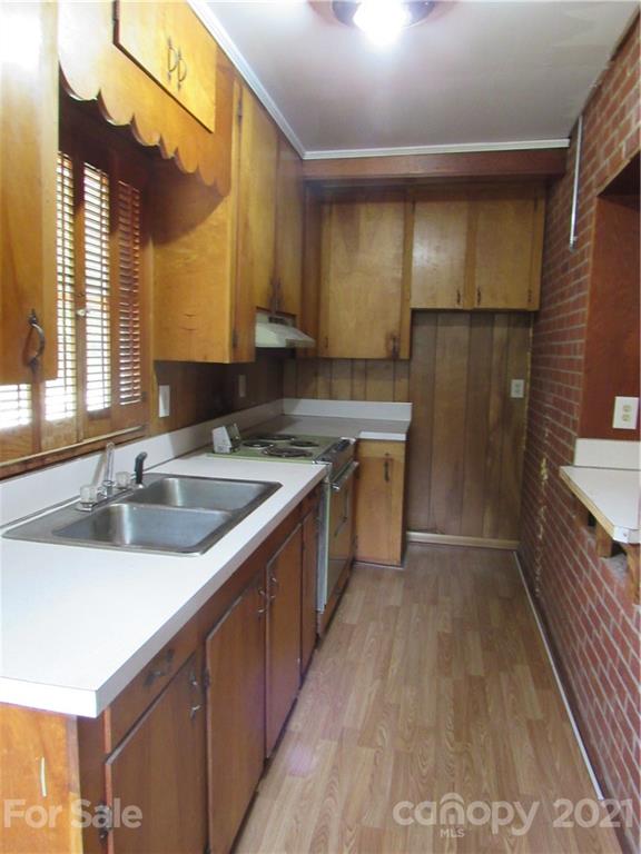 301 Highway 221 Rutherfordton, NC 28139 - Photo 3 of 28 a kitchen with a sink stove top oven and cabinets