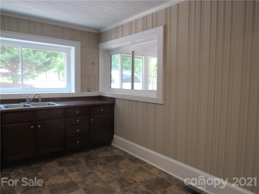 301 Highway 221 Rutherfordton, NC 28139 - Photo 5 of 28 a room with a sink window and a mirror