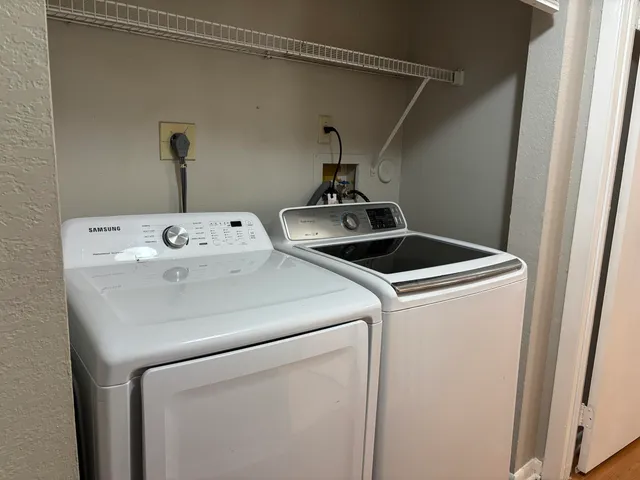 a utility room with dryer and washer
