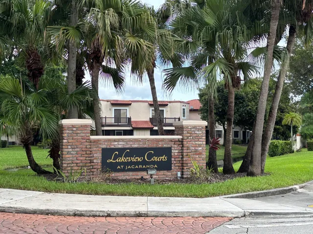 a view of a park with plants and trees