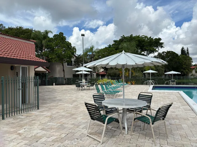 a patio with a table and chairs