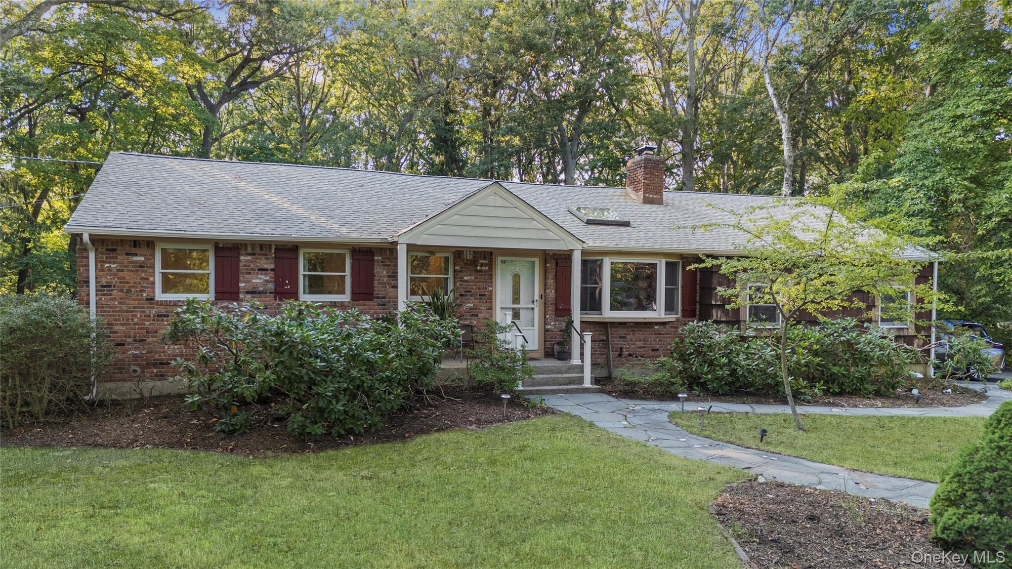 30 Yorktown Road Setauket, NY 11733 - Photo 1 of 1 a front view of a house with garden