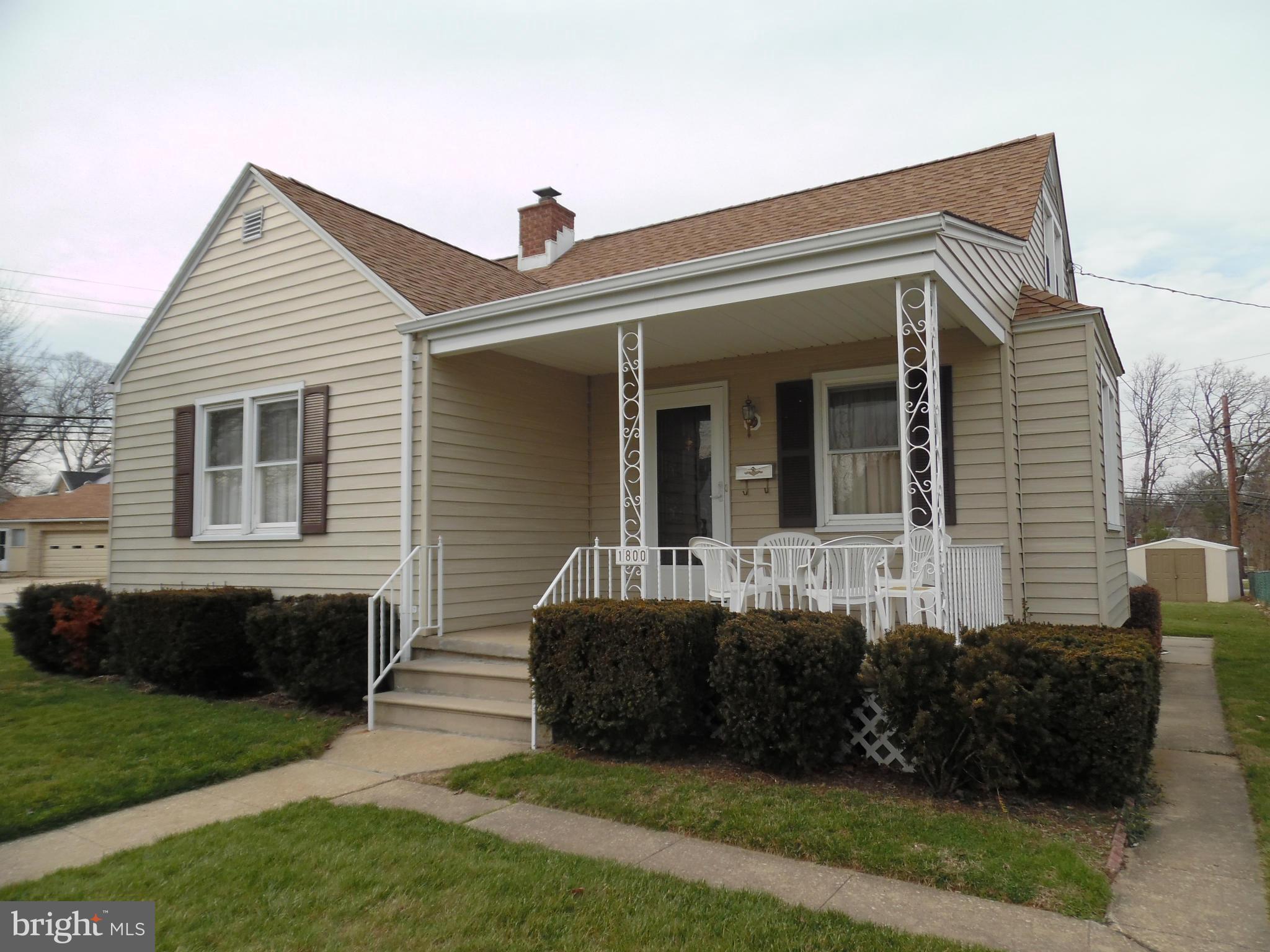 1800 Forrest Road Baltimore, MD 21234 - Photo 1 of 17 a front view of a house with a garden