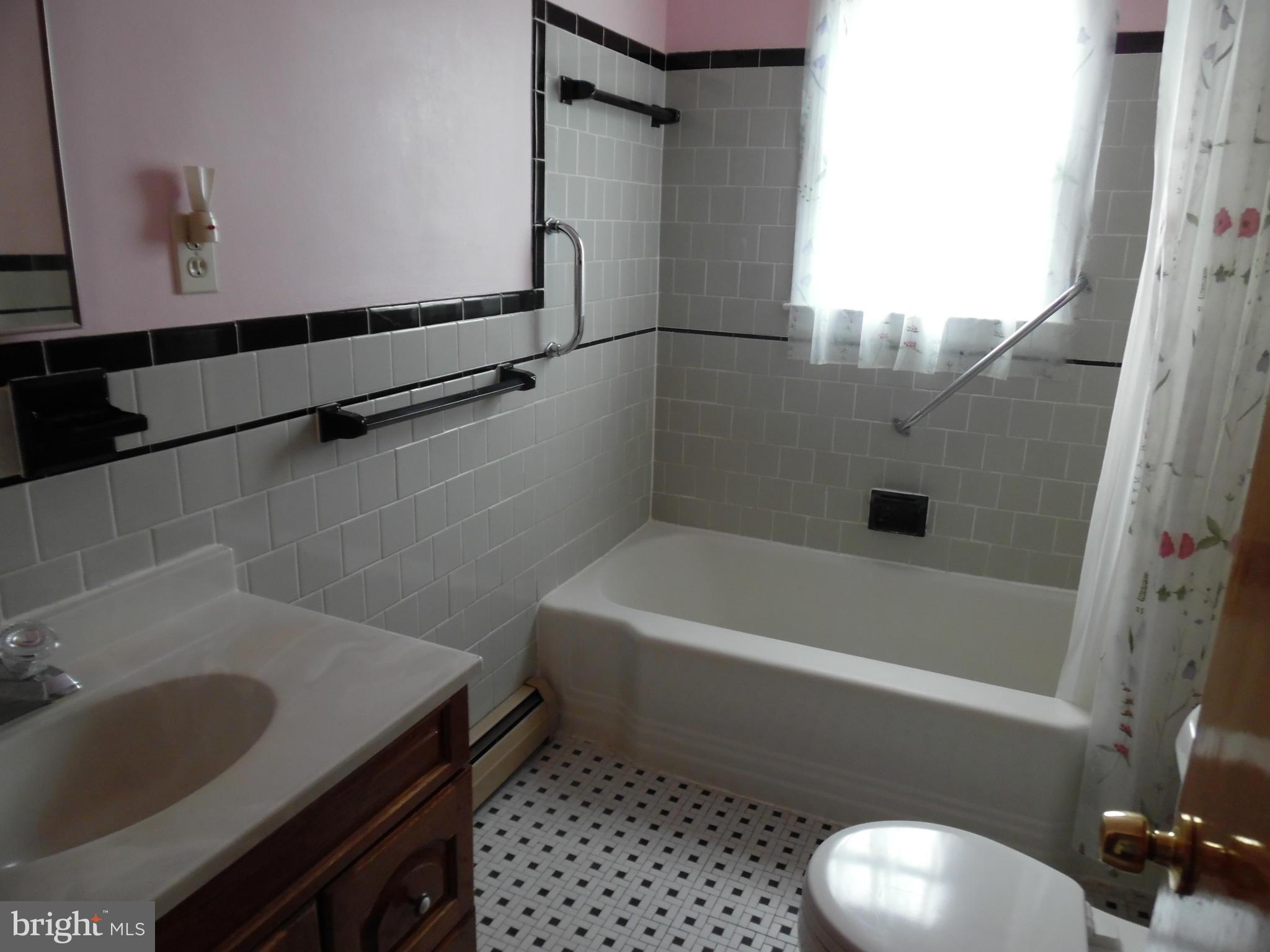 1800 Forrest Road Baltimore, MD 21234 - Photo 11 of 17 a bathroom with a sink and a bathtub