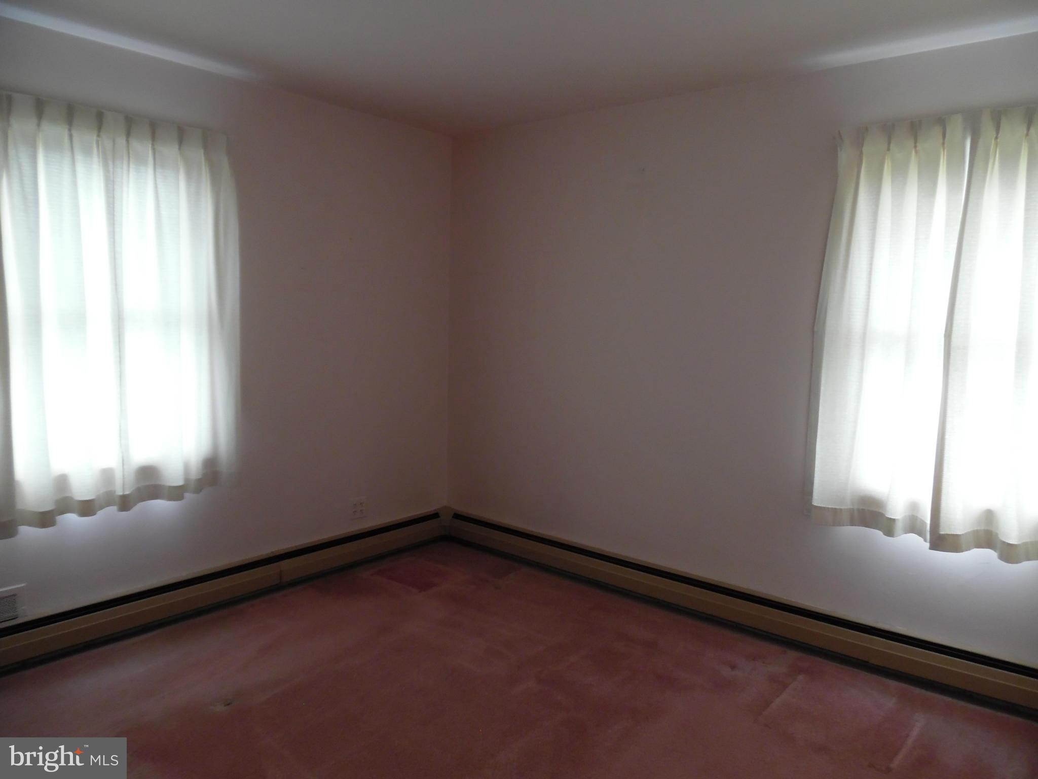 1800 Forrest Road Baltimore, MD 21234 - Photo 8 of 17 a view of an empty room and window