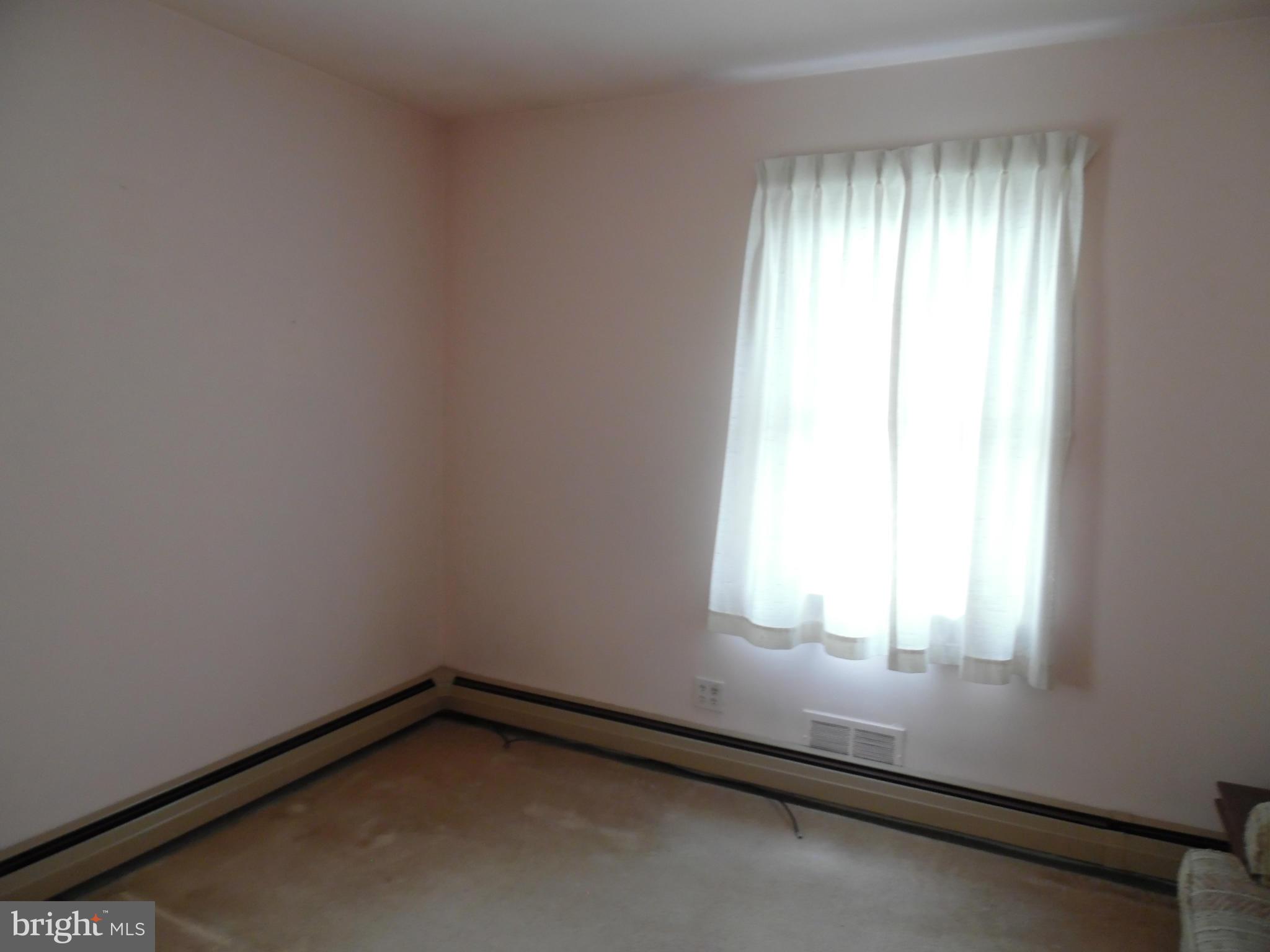 1800 Forrest Road Baltimore, MD 21234 - Photo 9 of 17 an empty room with a window