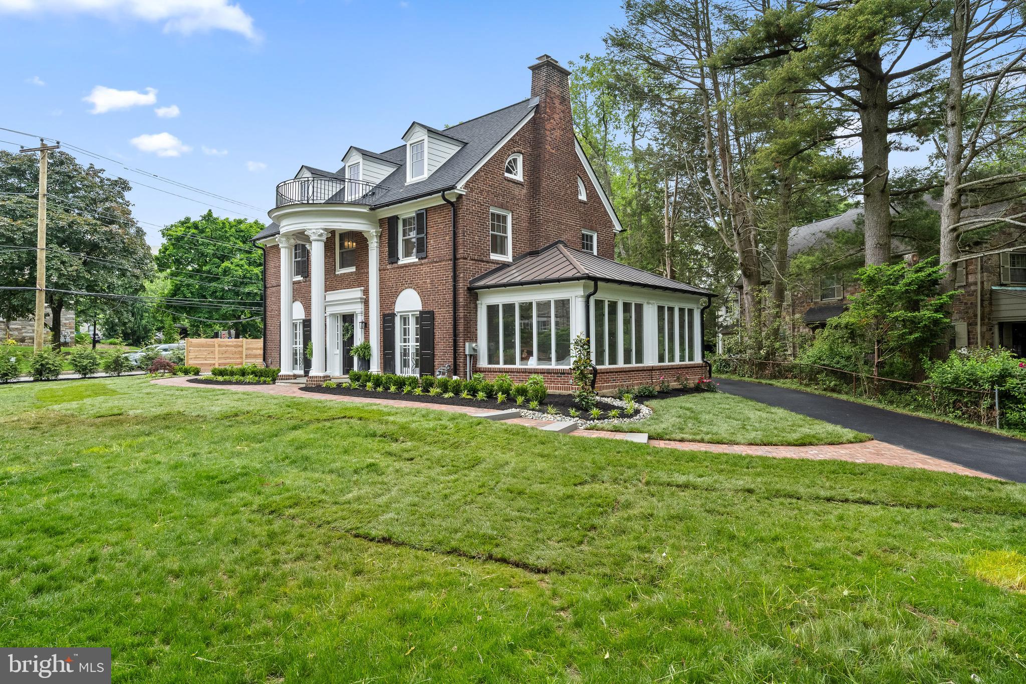 200 Hilldale Road, Unit 1 Villanova, PA 19085 - Photo 2 of 58 a front view of a house with a garden