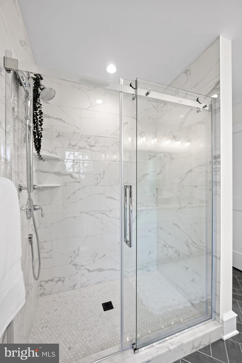 200 Hilldale Road, Unit 1 Villanova, PA 19085 - Photo 31 of 58 a bathroom with a glass shower door