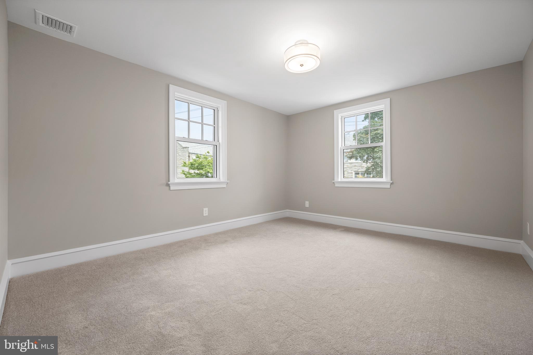 200 Hilldale Road, Unit 1 Villanova, PA 19085 - Photo 40 of 58 an empty room with windows