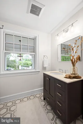 a bathroom with a sink toilet a mirror and shower