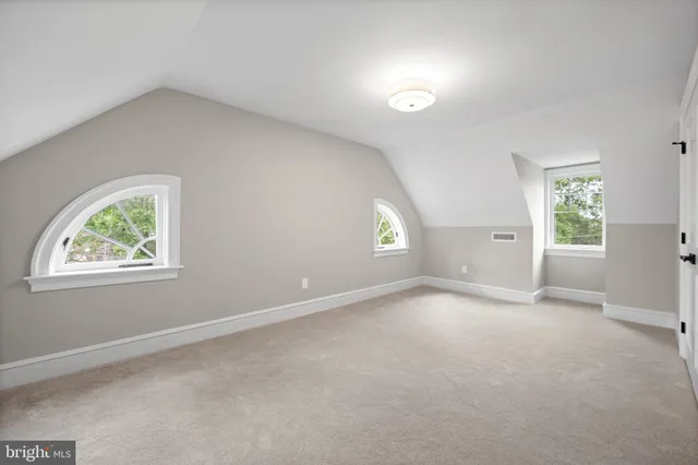 a view of a patio with couches and potted plants