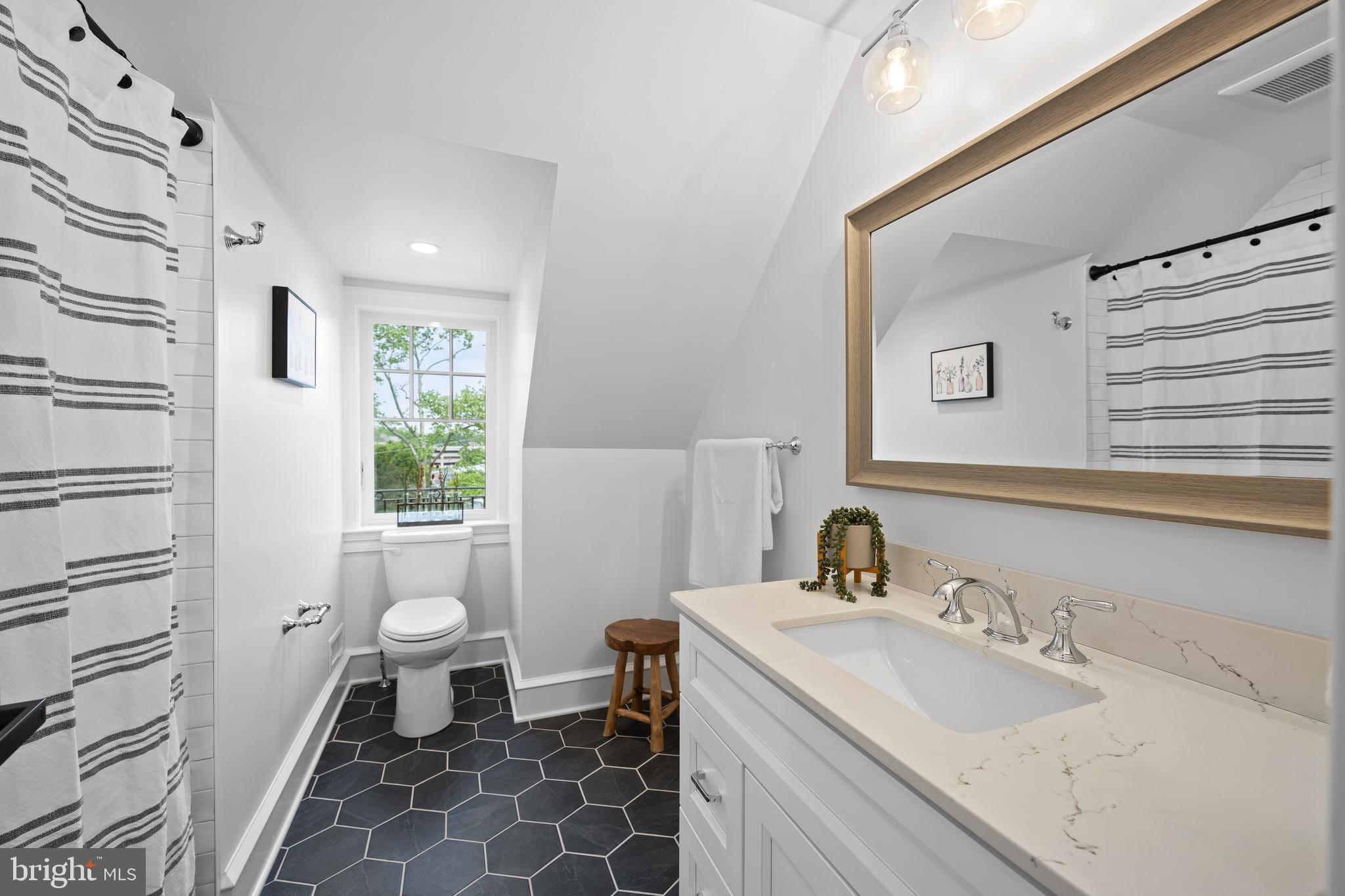 200 Hilldale Road, Unit 1 Villanova, PA 19085 - Photo 50 of 58 a bathroom with a sink toilet a mirror and shower