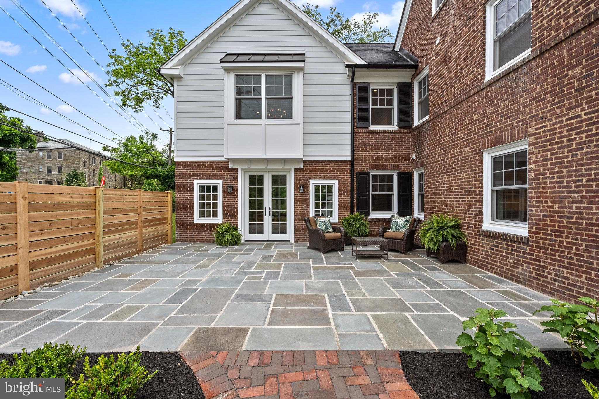 200 Hilldale Road, Unit 1 Villanova, PA 19085 - Photo 54 of 58 a view of a house with a small yard plants and large tree
