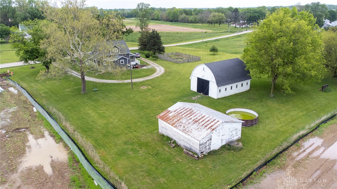 190 Swailes Road Troy, OH 45373 - Photo 47 of 82 This expansive estate features multiple structures nestled amidst lush green surroundings, offering serene rural living.
