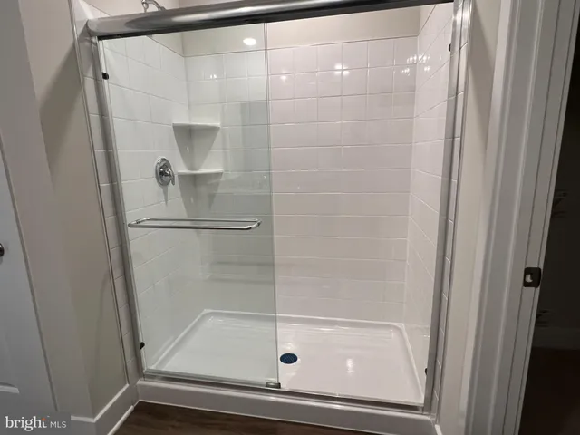 a bathroom with a glass shower door