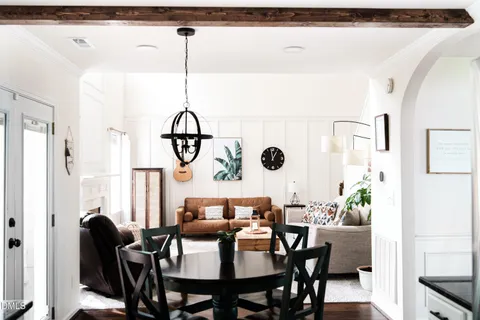 a view of a dining room with furniture and window